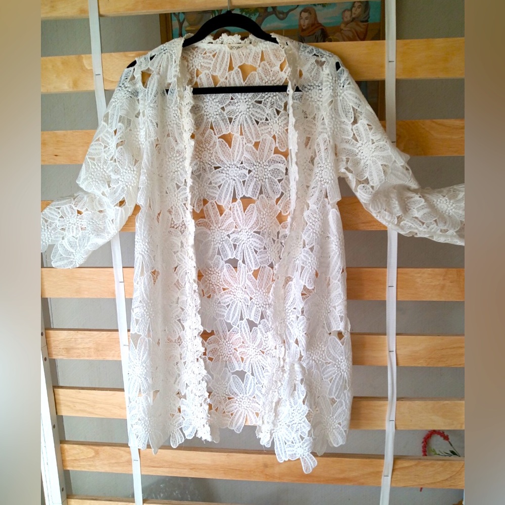 Lace cover up to be layered over apparel.